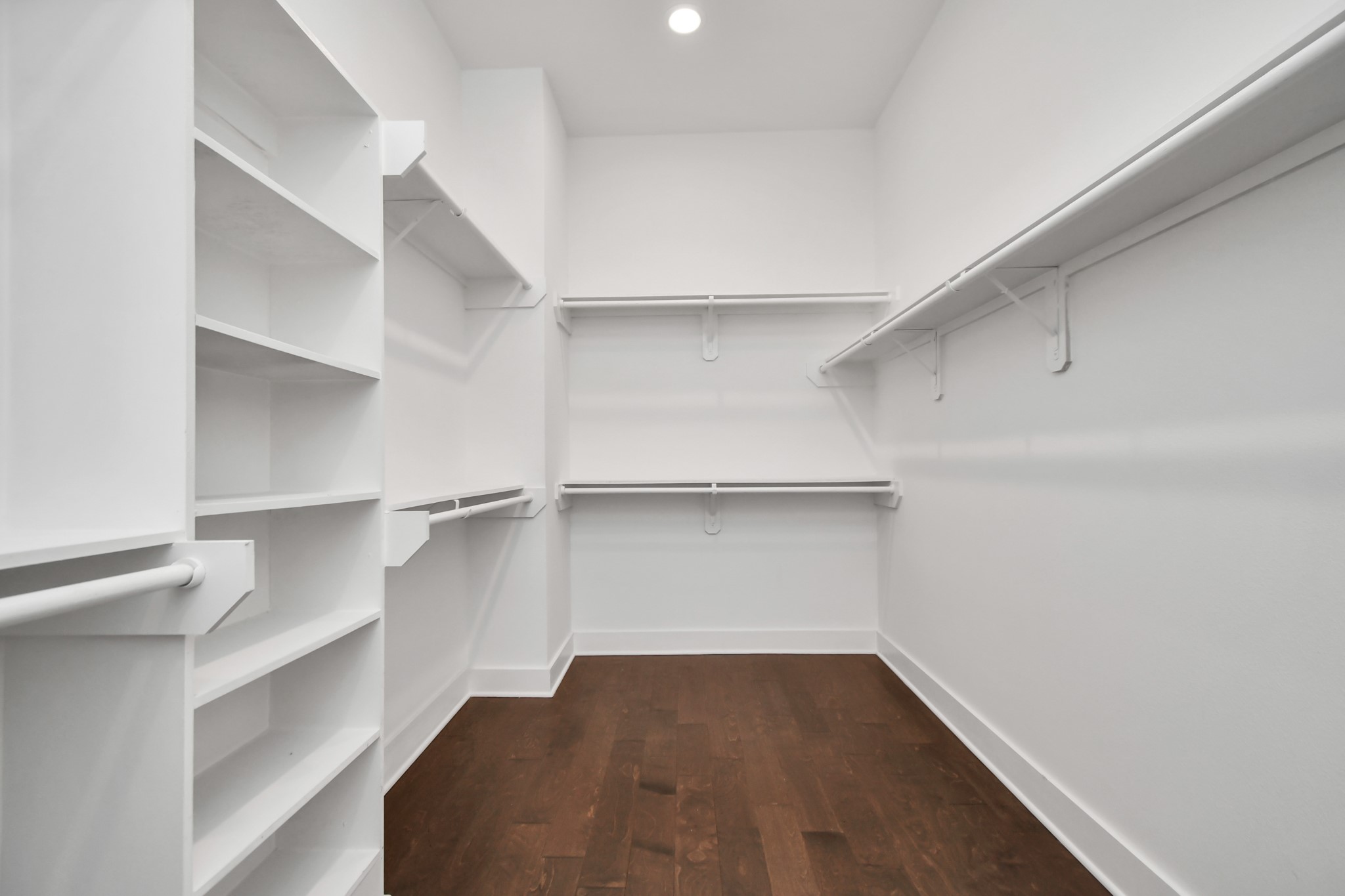 853 Mansfield Street, Unit E Houston, TX 77091 - Photo 40 of 47 a view of walk in closet with empty racks