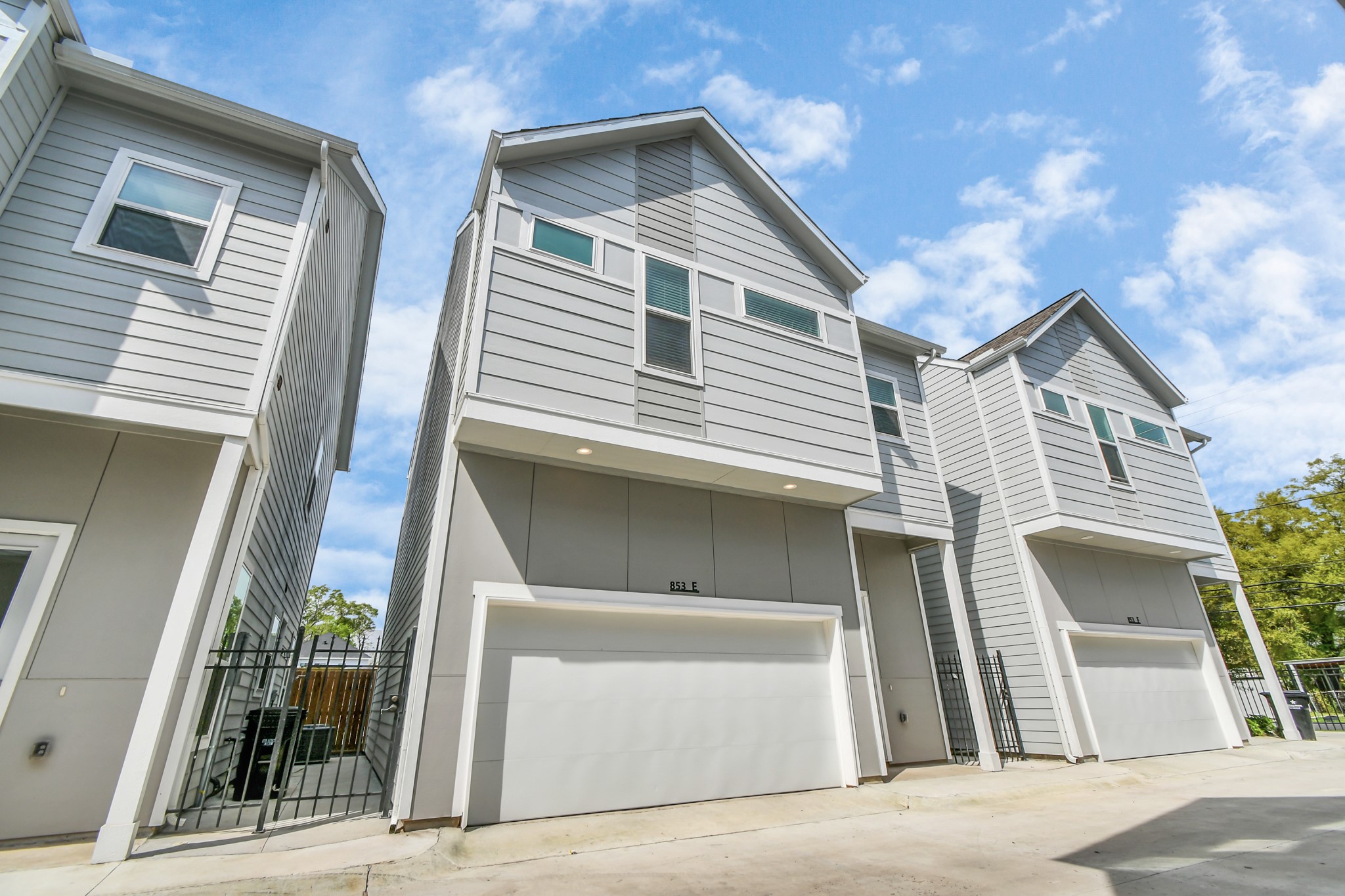 853 Mansfield Street, Unit E Houston, TX 77091 - Photo 43 of 47 a front view of a house with garden