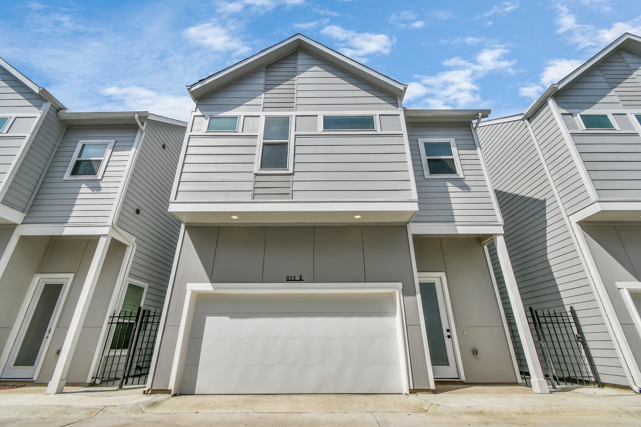 853 Mansfield Street, Unit E Houston, TX 77091 - Photo 7 of 47 a view of a house with wooden fence