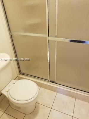 10425 Southwest 112th Avenue, Unit 211 Miami, FL 33176 - Photo 9 of 18 a bathroom with a sink and a mirror