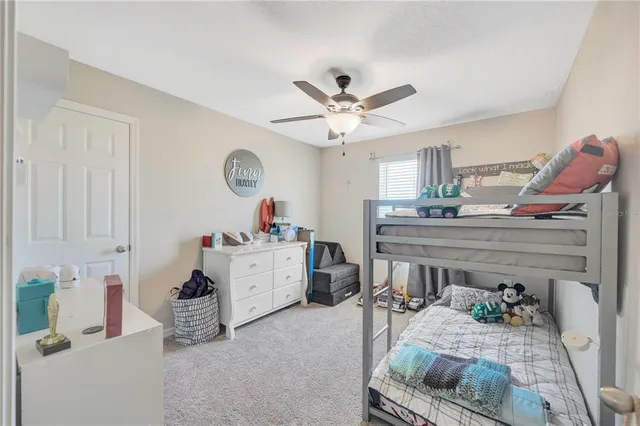 a living room with furniture and a clock