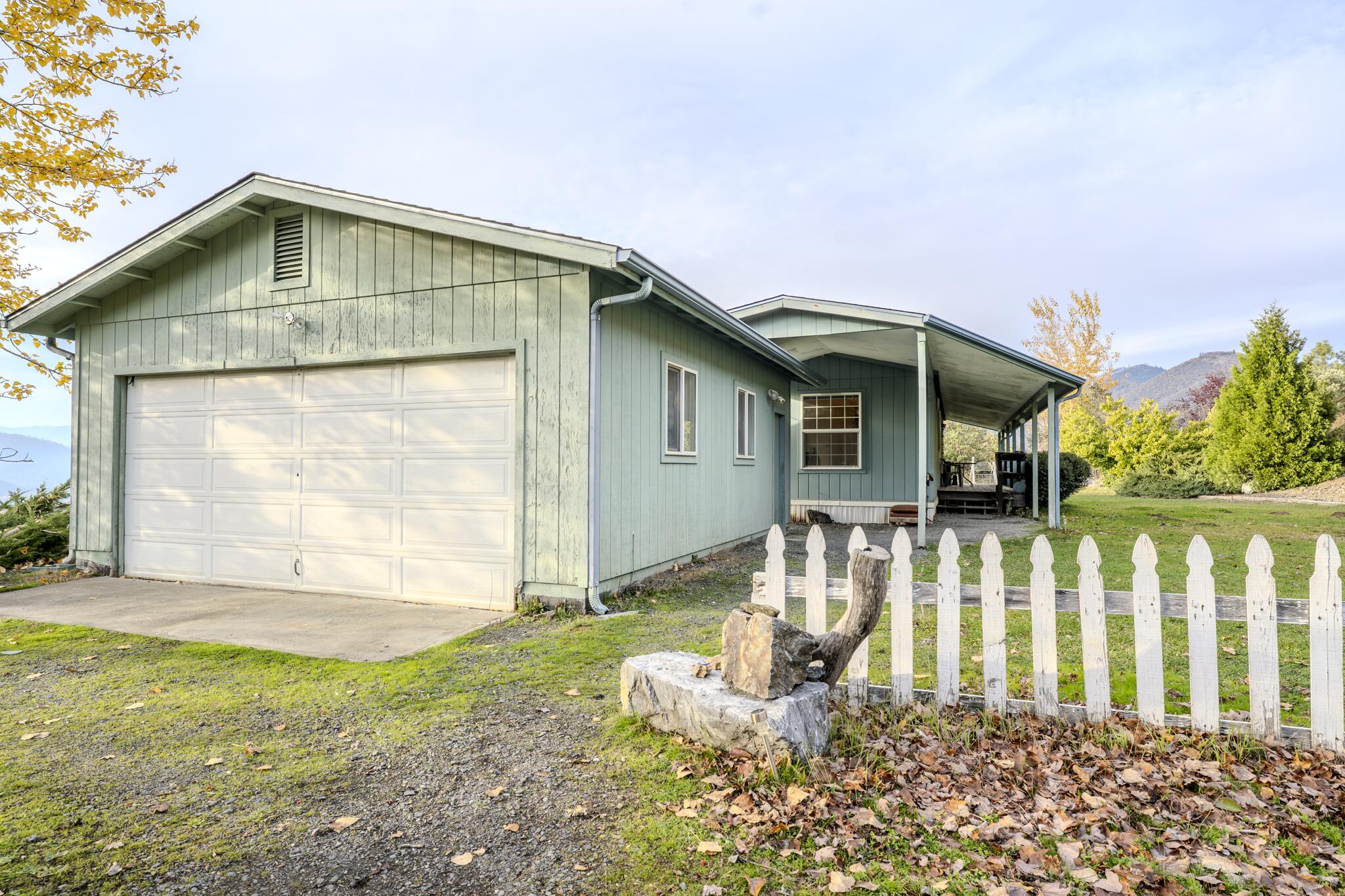 362 Humbug Creek Road Jacksonville, OR 97530 - Photo 8 of 49 a front view of a house with a garden