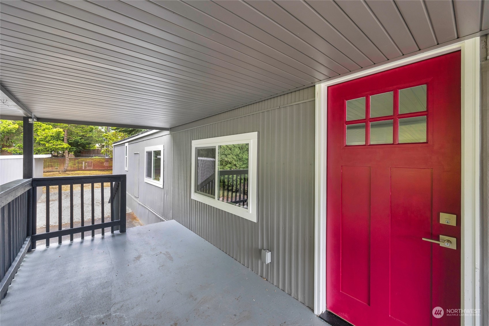 1121 244th Street Southwest, Unit 28 Bothell, WA 98021 - Photo 1 of 4 a view of a porch with furniture and window