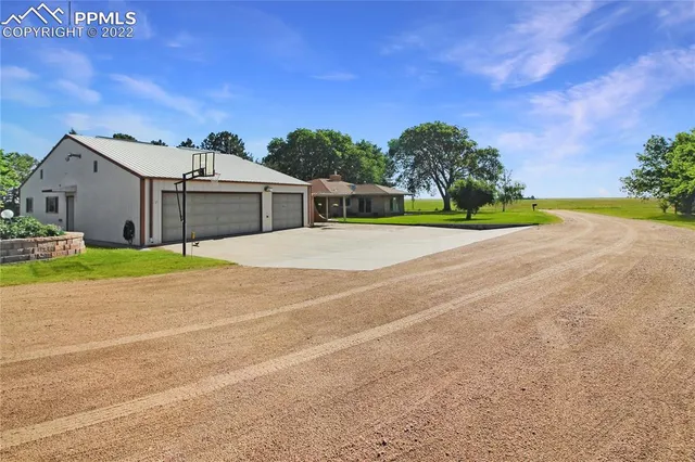 a view of a house with basketball court