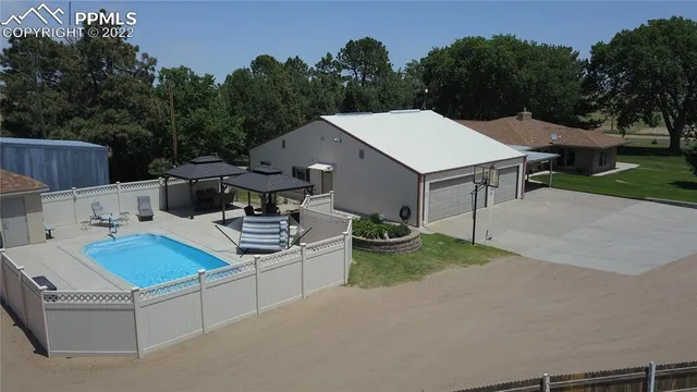a view of a patio in backyard