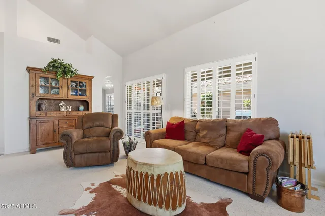 a bedroom with a bed and a lamp