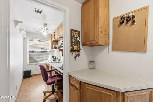 an aerial view of residential houses with outdoor space and ocean view