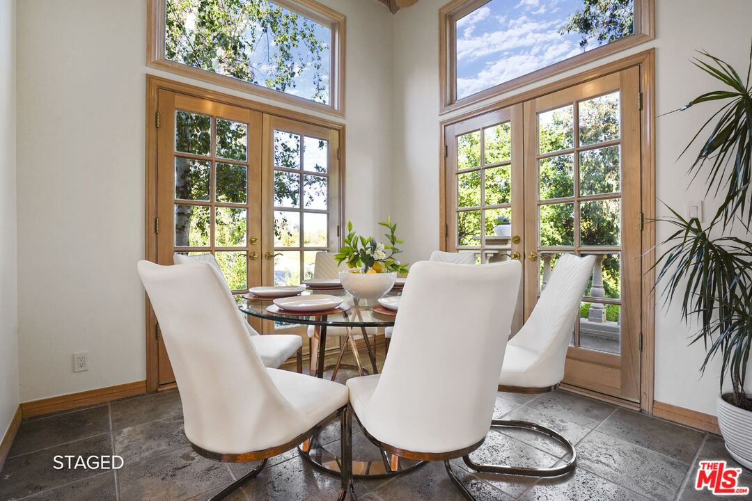 19 Ranchero Road Bell Canyon, CA 91307 - Photo 13 of 46 a dining room with furniture wooden floor and a potted plant