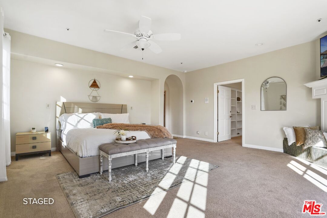 19 Ranchero Road Bell Canyon, CA 91307 - Photo 20 of 46 a bedroom with a bed and a chandelier