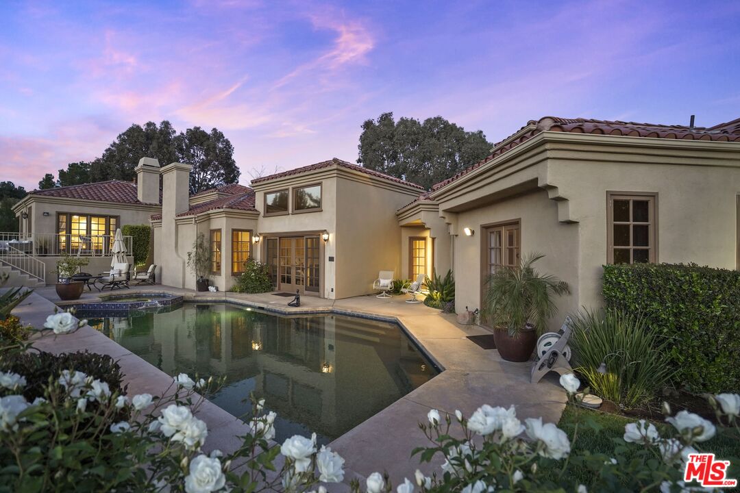 19 Ranchero Road Bell Canyon, CA 91307 - Photo 2 of 46 a view of a house with swimming pool and a yard