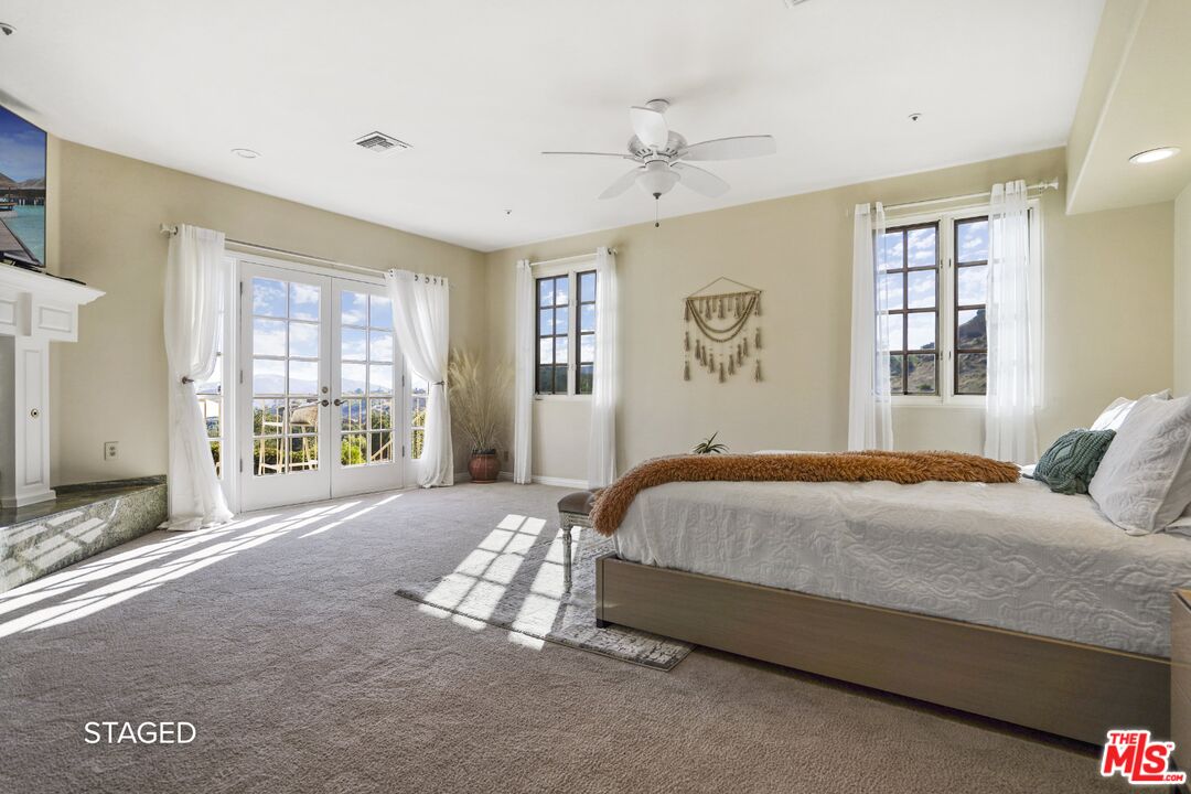 19 Ranchero Road Bell Canyon, CA 91307 - Photo 22 of 46 a bedroom with a large bed and a window