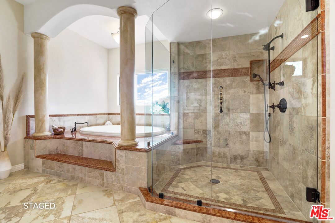 19 Ranchero Road Bell Canyon, CA 91307 - Photo 24 of 46 a bathroom with a tub and shower