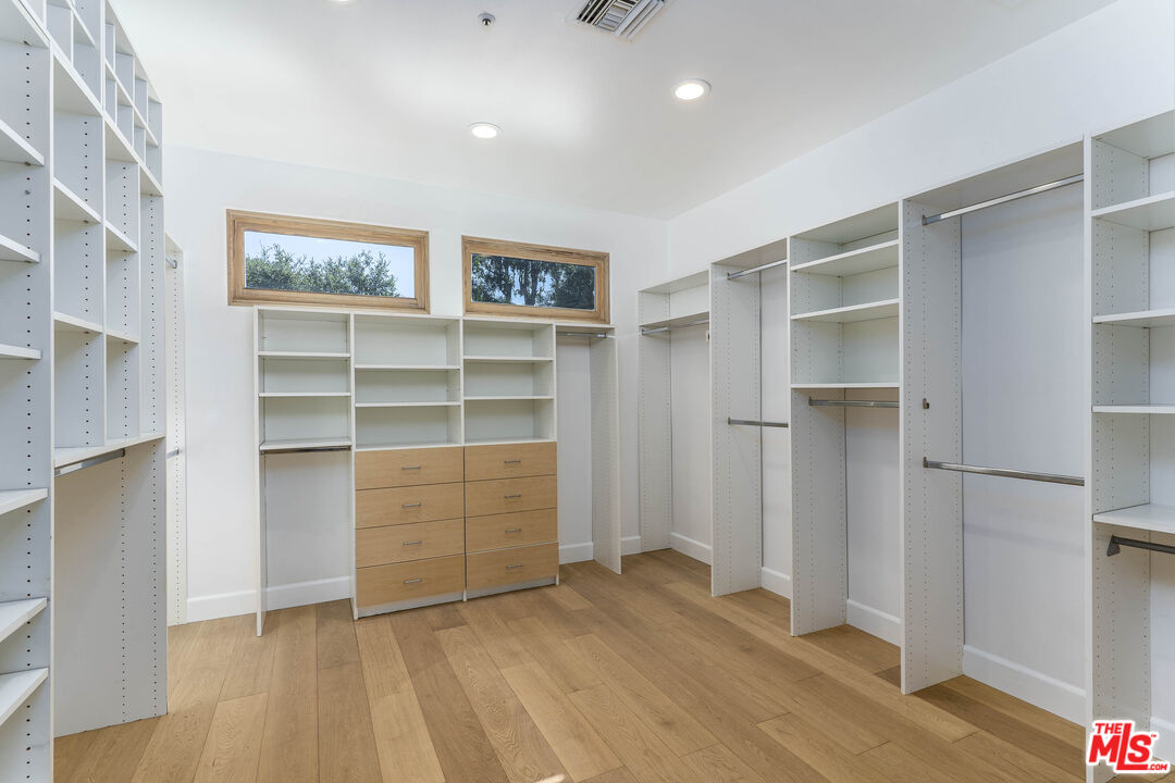 19 Ranchero Road Bell Canyon, CA 91307 - Photo 28 of 46 a view of an empty room with cabinet and a window