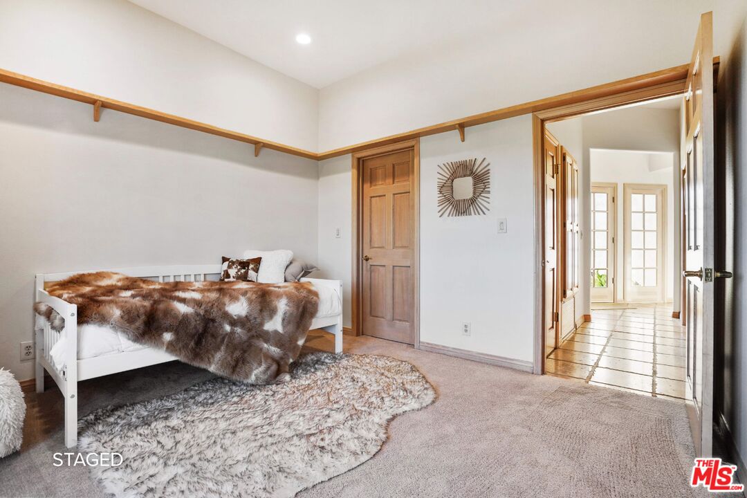 19 Ranchero Road Bell Canyon, CA 91307 - Photo 30 of 46 a bedroom with a bed and wooden floor