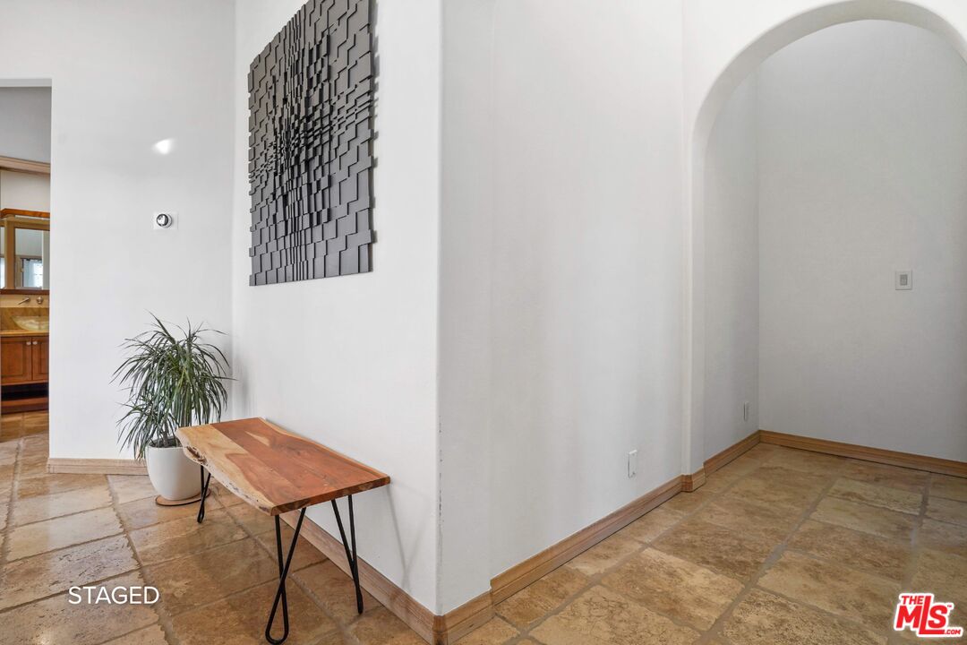 19 Ranchero Road Bell Canyon, CA 91307 - Photo 31 of 46 a view of a room with a potted plant and wooden floor