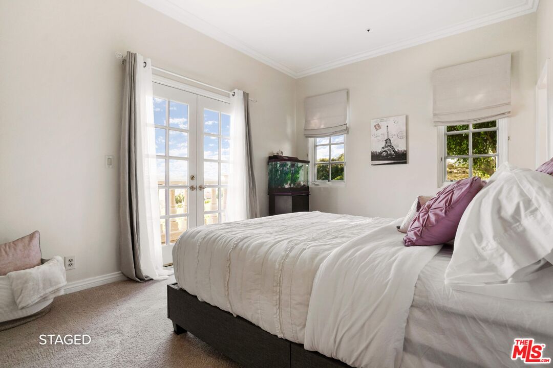 19 Ranchero Road Bell Canyon, CA 91307 - Photo 33 of 46 a bedroom with a bed and window