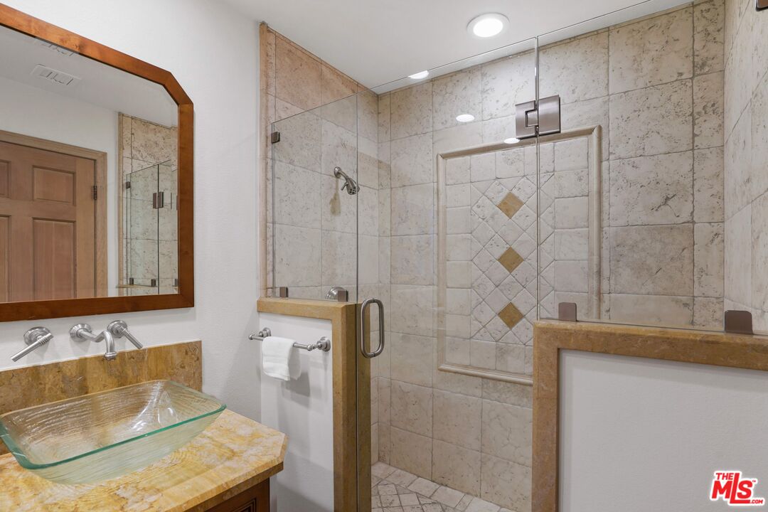 19 Ranchero Road Bell Canyon, CA 91307 - Photo 36 of 46 a bathroom with a tub sink and mirror