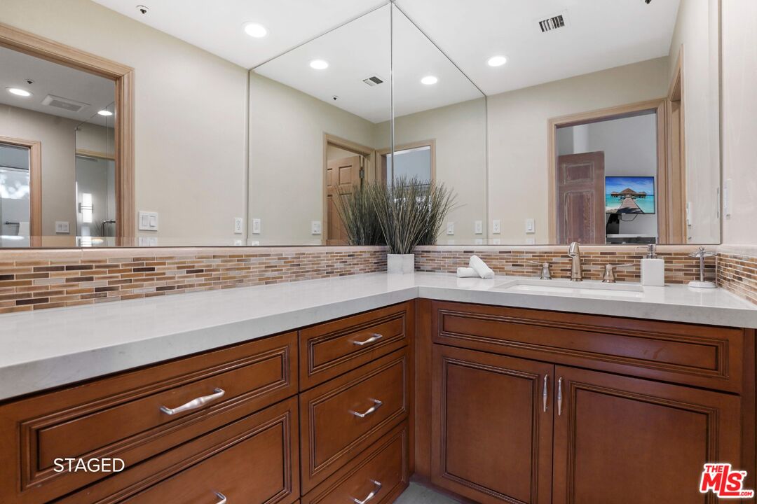 19 Ranchero Road Bell Canyon, CA 91307 - Photo 39 of 46 a bathroom with a sink and a mirror