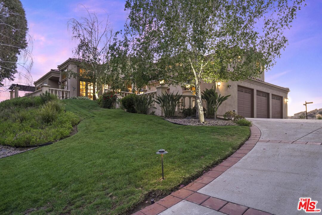 19 Ranchero Road Bell Canyon, CA 91307 - Photo 4 of 46 a front view of a house with garden