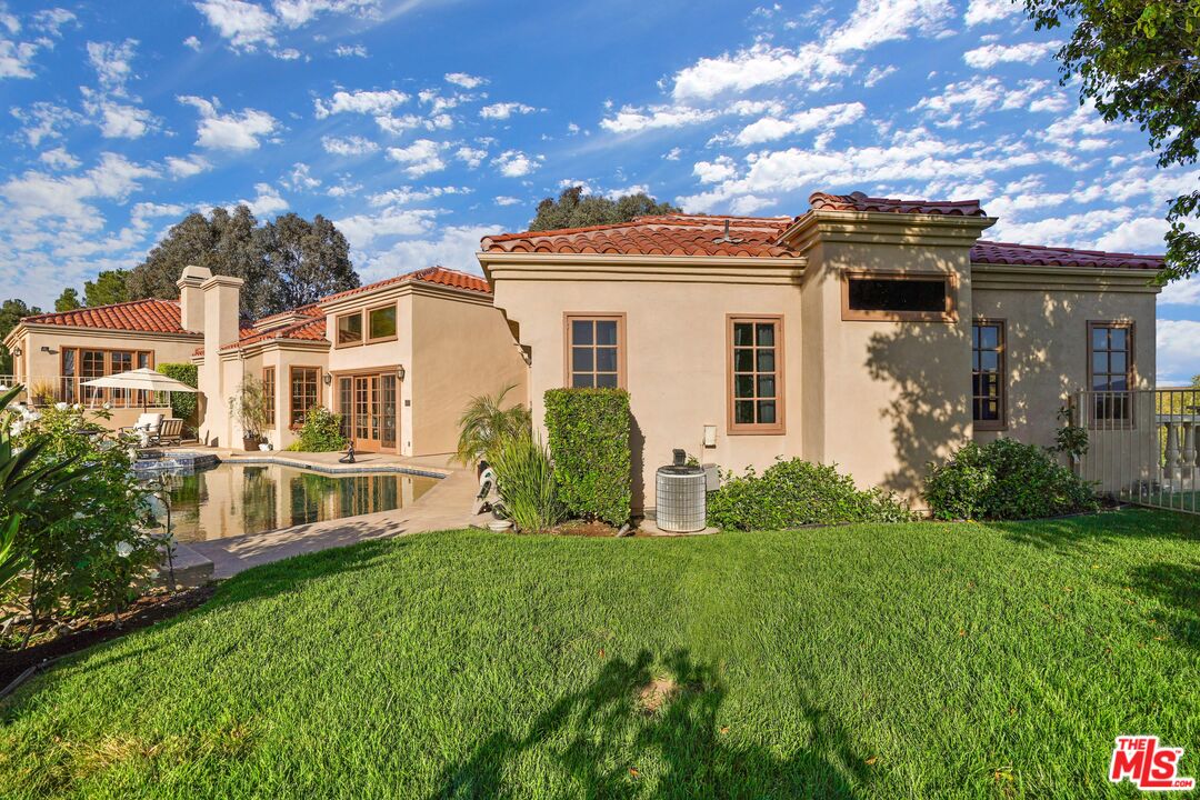 19 Ranchero Road Bell Canyon, CA 91307 - Photo 43 of 46 a front view of a house with a yard
