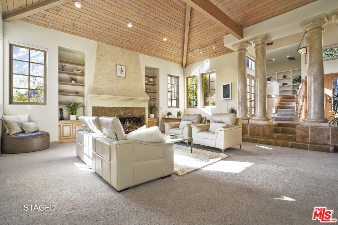 19 Ranchero Road Bell Canyon, CA 91307 - Photo 6 of 46 a living room with furniture and a fireplace