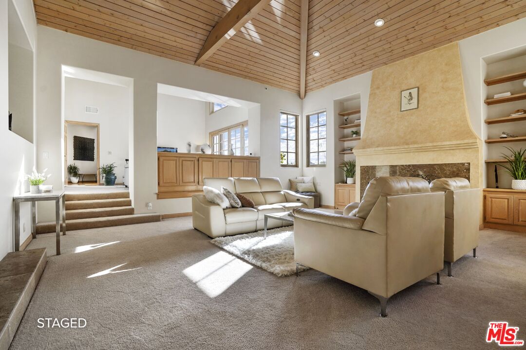 19 Ranchero Road Bell Canyon, CA 91307 - Photo 8 of 46 a living room with furniture and a chandelier