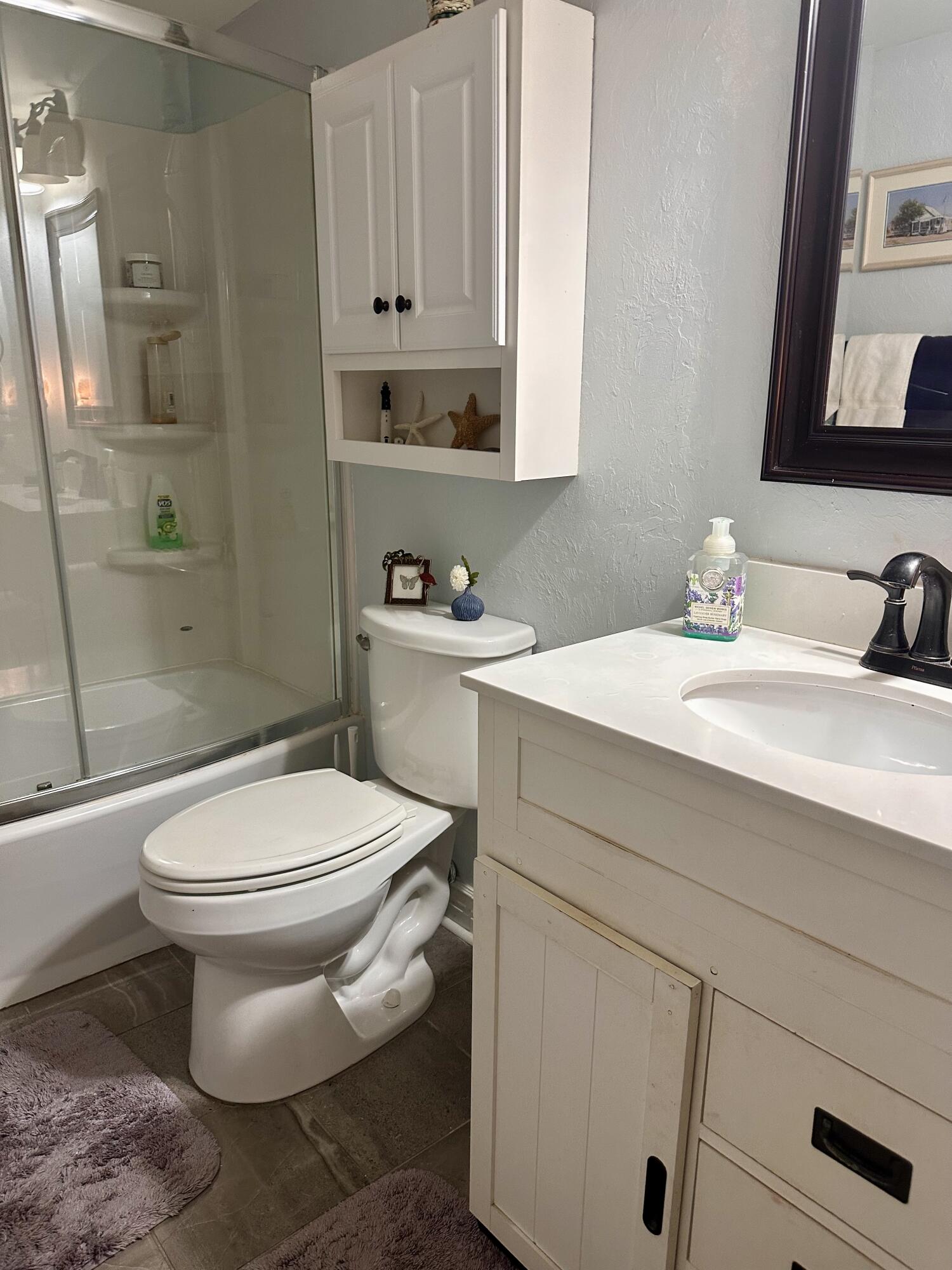 1831 Southwest Palm City Road, Unit C601 Stuart, FL 34994 - Photo 24 of 35 guest bath-tub/shower
