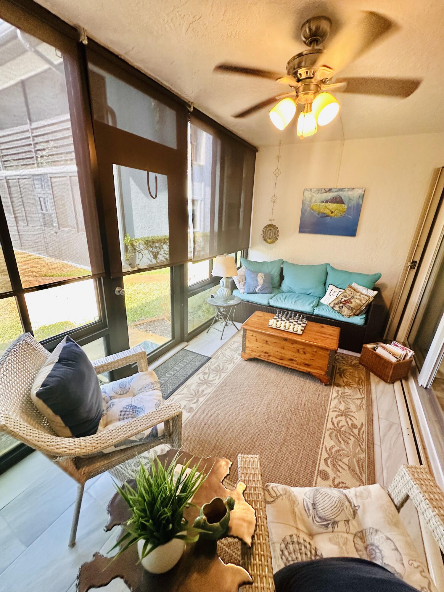 1831 Southwest Palm City Road, Unit C601 Stuart, FL 34994 - Photo 29 of 35 Glass porch