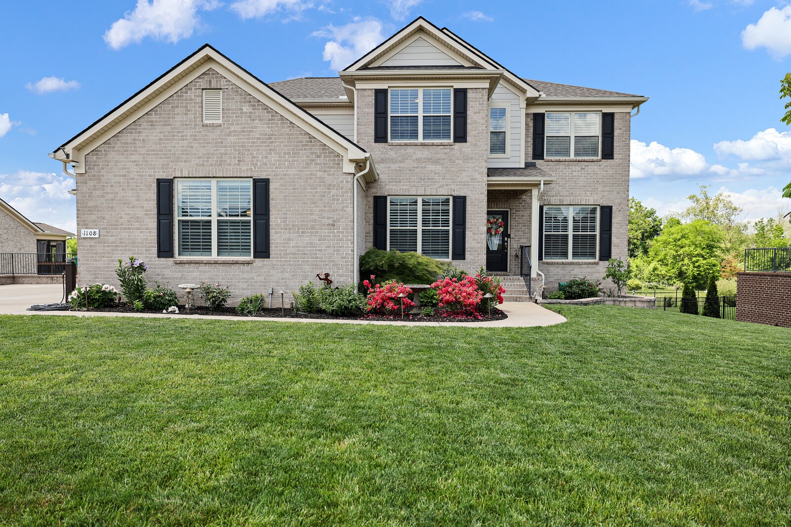 1108 Brixworth Drive Spring Hill, TN 37174 - Photo 1 of 100 a front view of a house with a yard and garage