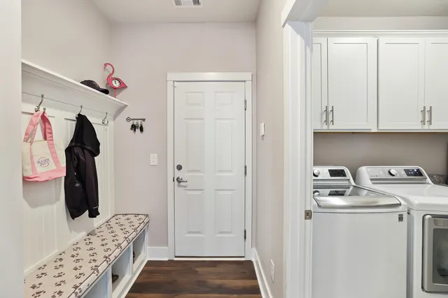a kitchen with sink stove and cabinets