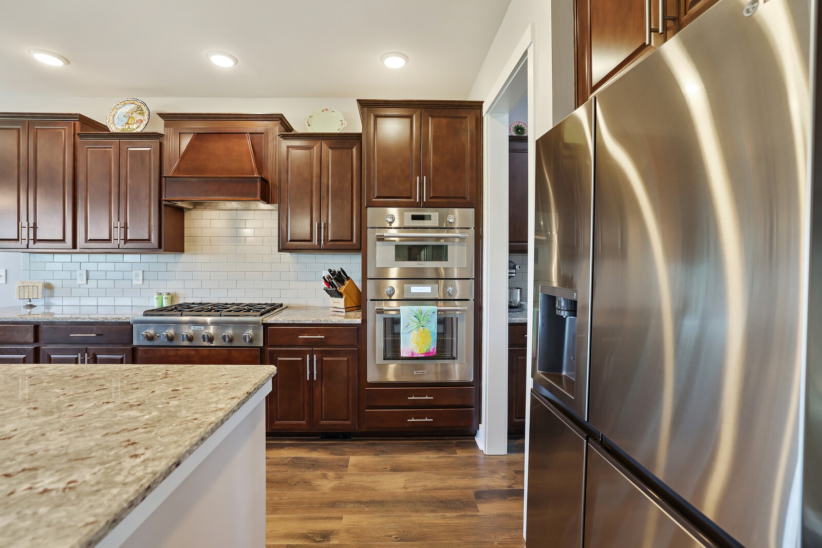1108 Brixworth Drive Spring Hill, TN 37174 - Photo 22 of 100 a kitchen with stainless steel appliances granite countertop refrigerator a stove and a sink