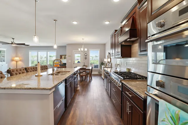 a spacious bedroom with a bed and a ceiling fan