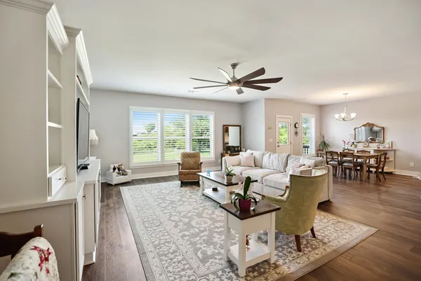 a view of a livingroom with furniture and a flat screen tv