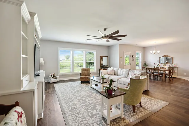 a view of a livingroom with furniture and a flat screen tv