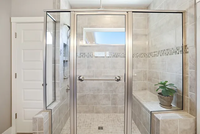 a living room with furniture a large window and a table