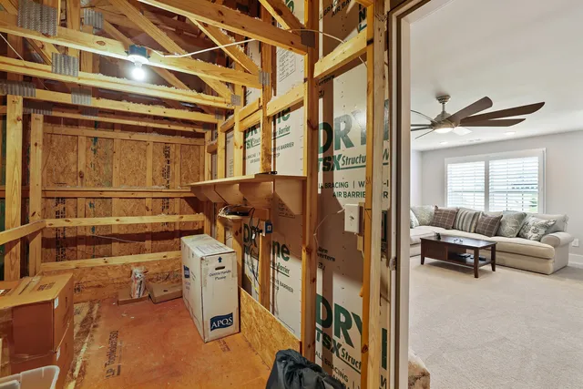 an aerial view of a house with a garden and swimming pool