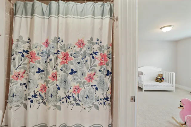 a aerial view of a house with a yard table and chairs