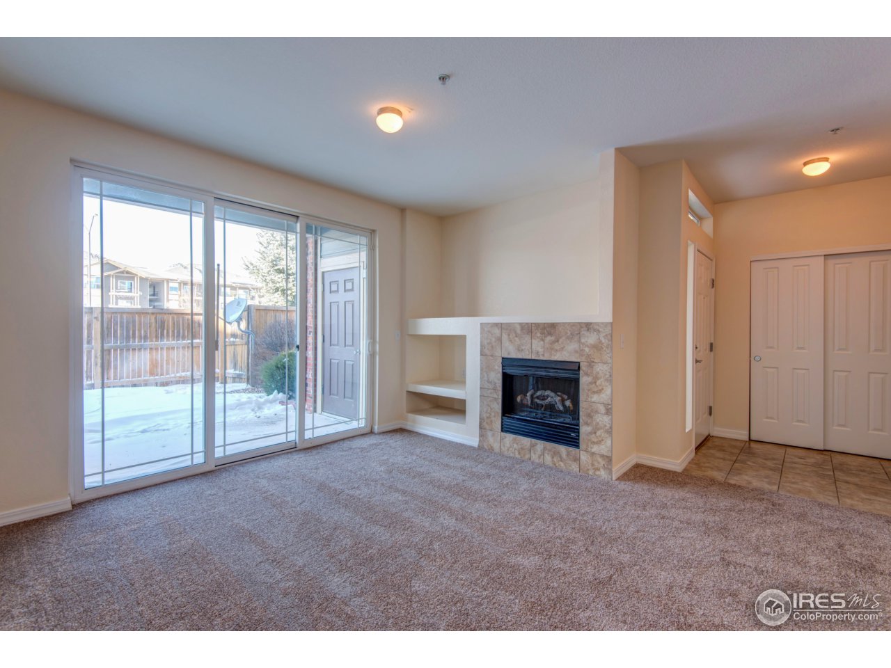 2133 Krisron Road, Unit E108 Fort Collins, CO 80525 - Photo 3 of 24 Living Room with Fireplace