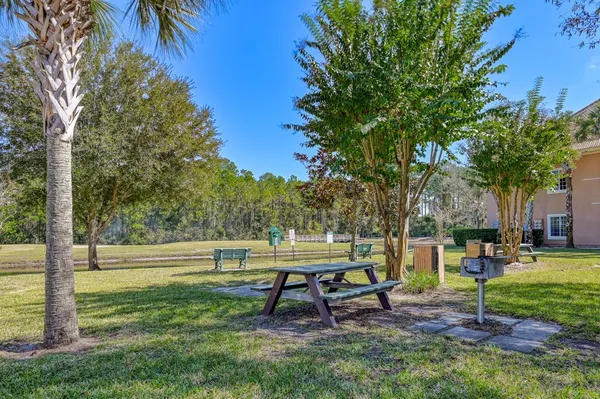 a bench sitting in the middle of a park