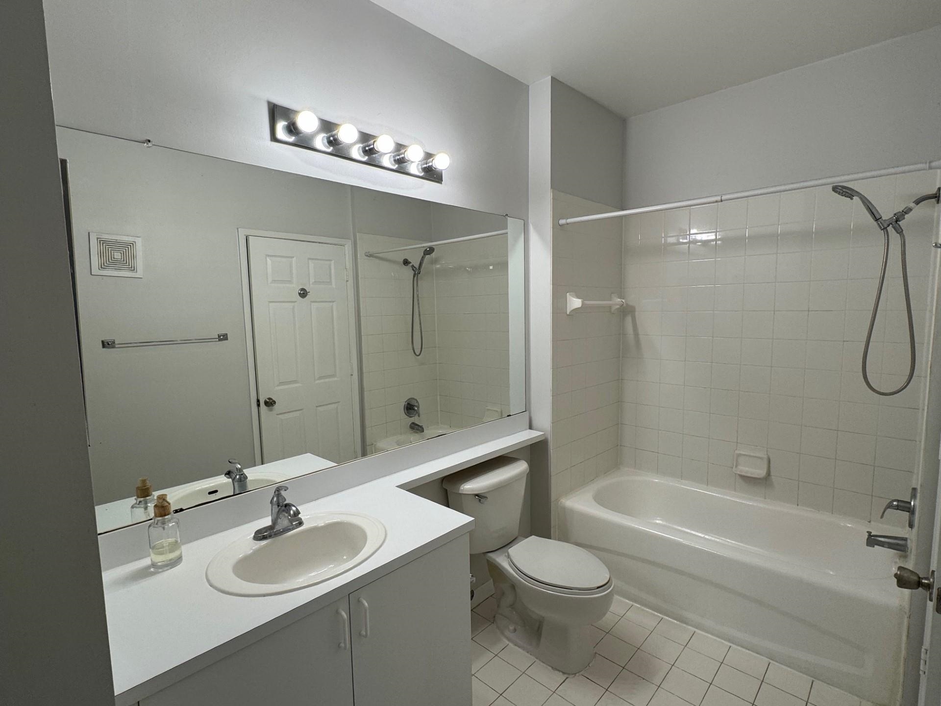 510 Florida Club Boulevard, Unit 303 St. Augustine, FL 32084 - Photo 7 of 24 a bathroom with a sink a toilet and shower