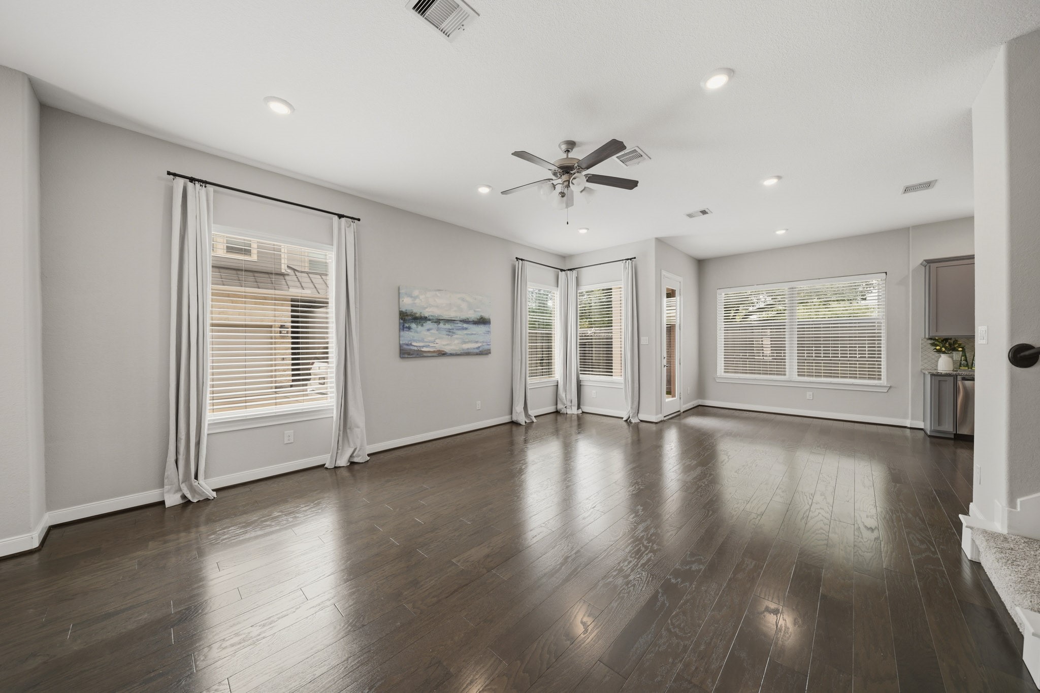 4103 Tranquil Square Road Houston, TX 77043 - Photo 6 of 39 Warm and inviting family room featuring rich hardwood floors and recessed lighting creates an elegant setting for everyday living and effortless entertaining.