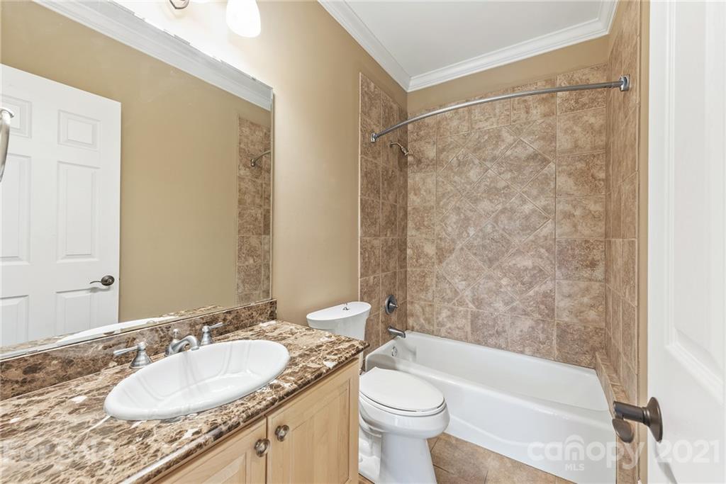 3268 Millstone Creek Road Lancaster, SC 29720 - Photo 14 of 35 a bathroom with a granite countertop sink toilet and shower
