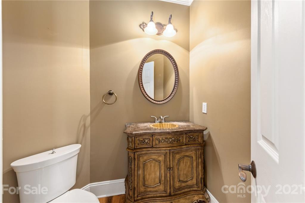 3268 Millstone Creek Road Lancaster, SC 29720 - Photo 15 of 35 a bathroom with a toilet a sink and a mirror