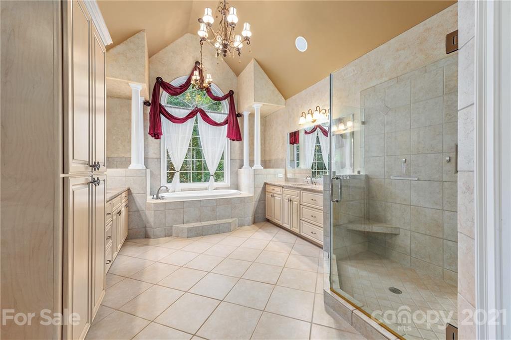 3268 Millstone Creek Road Lancaster, SC 29720 - Photo 17 of 35 a bathroom with a mirror sink and bathtub