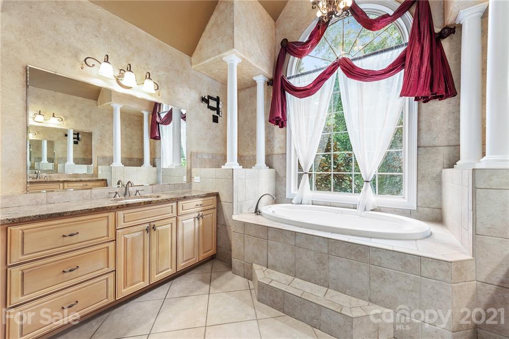 3268 Millstone Creek Road Lancaster, SC 29720 - Photo 18 of 35 a bathroom with a bathtub and a sink