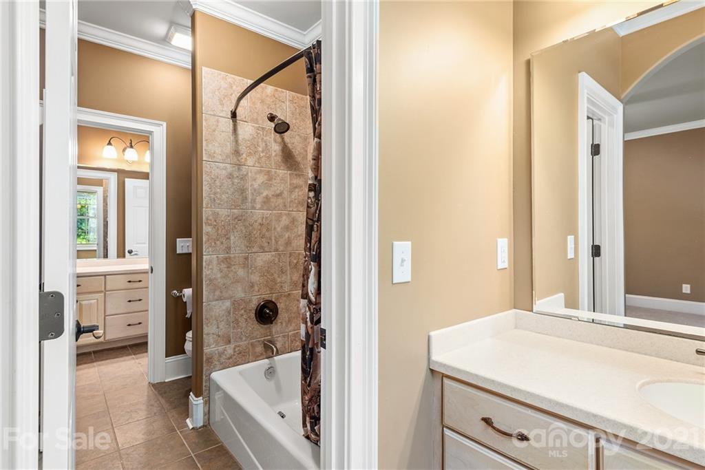 3268 Millstone Creek Road Lancaster, SC 29720 - Photo 21 of 35 a bathroom with a tub shower and sink