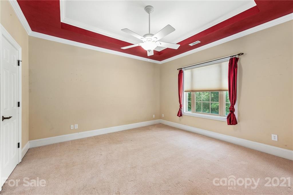 3268 Millstone Creek Road Lancaster, SC 29720 - Photo 23 of 35 a view of an empty room with window and chandelier fan