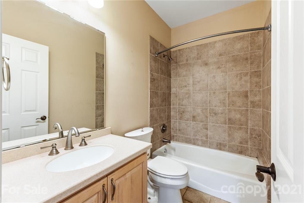 3268 Millstone Creek Road Lancaster, SC 29720 - Photo 24 of 35 a bathroom with a sink mirror toilet and bathtub