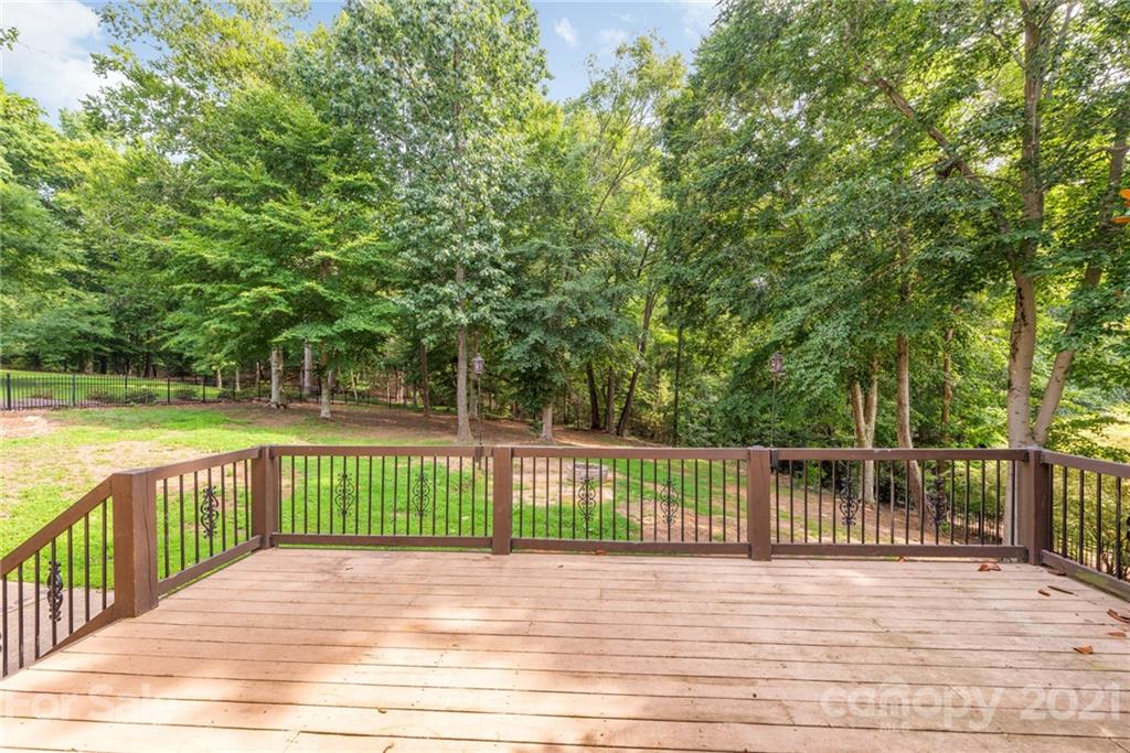 3268 Millstone Creek Road Lancaster, SC 29720 - Photo 32 of 35 a view of a wooden deck and a yard