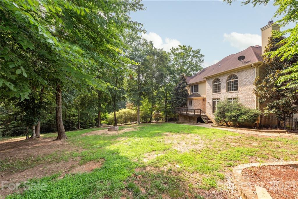 3268 Millstone Creek Road Lancaster, SC 29720 - Photo 33 of 35 a view of a house with a backyard and a tree